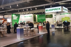 Trade fair booth of Südpack at Fachpack 2018 featuring sustainability-themed displays